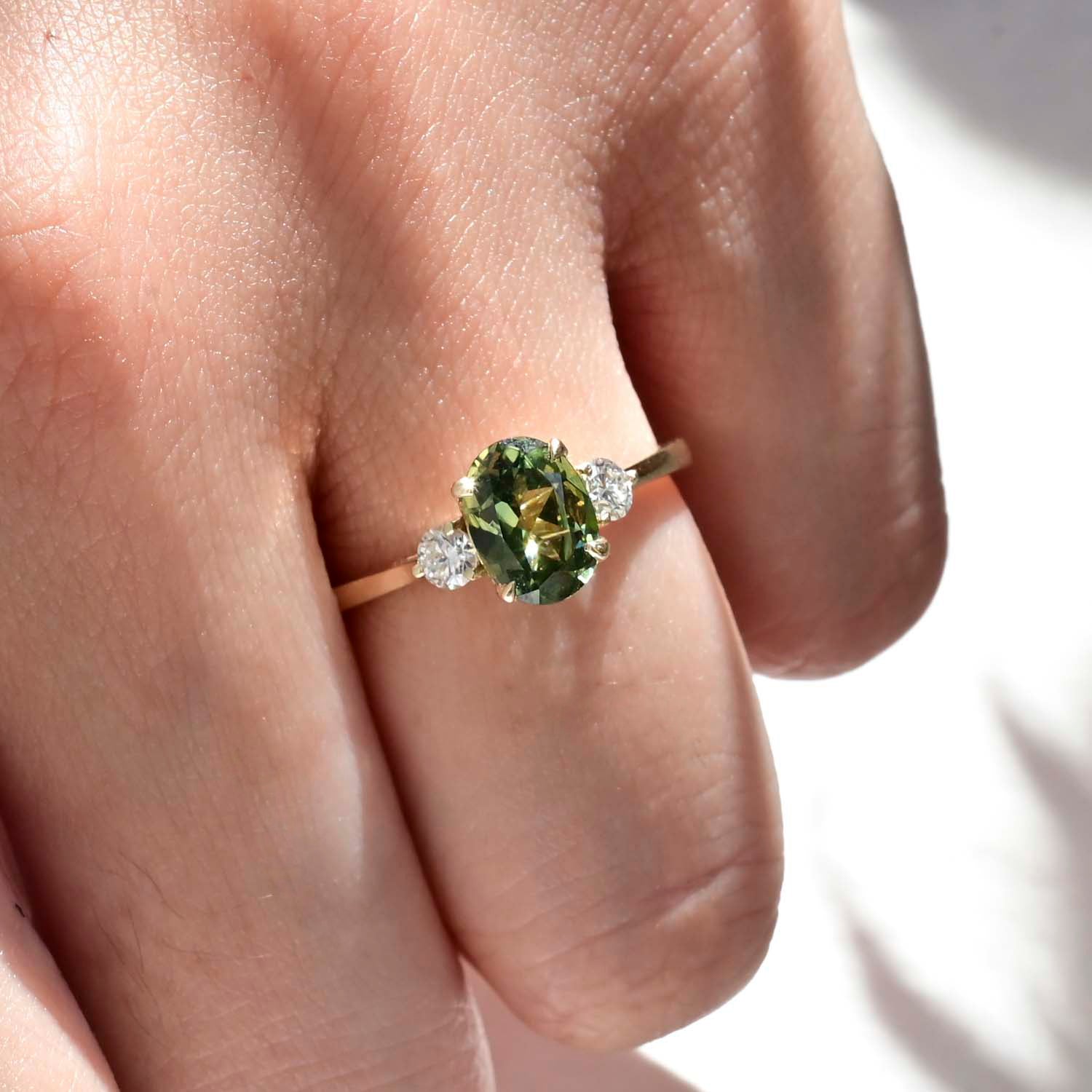 green sapphire engagement ring with ethical diamonds